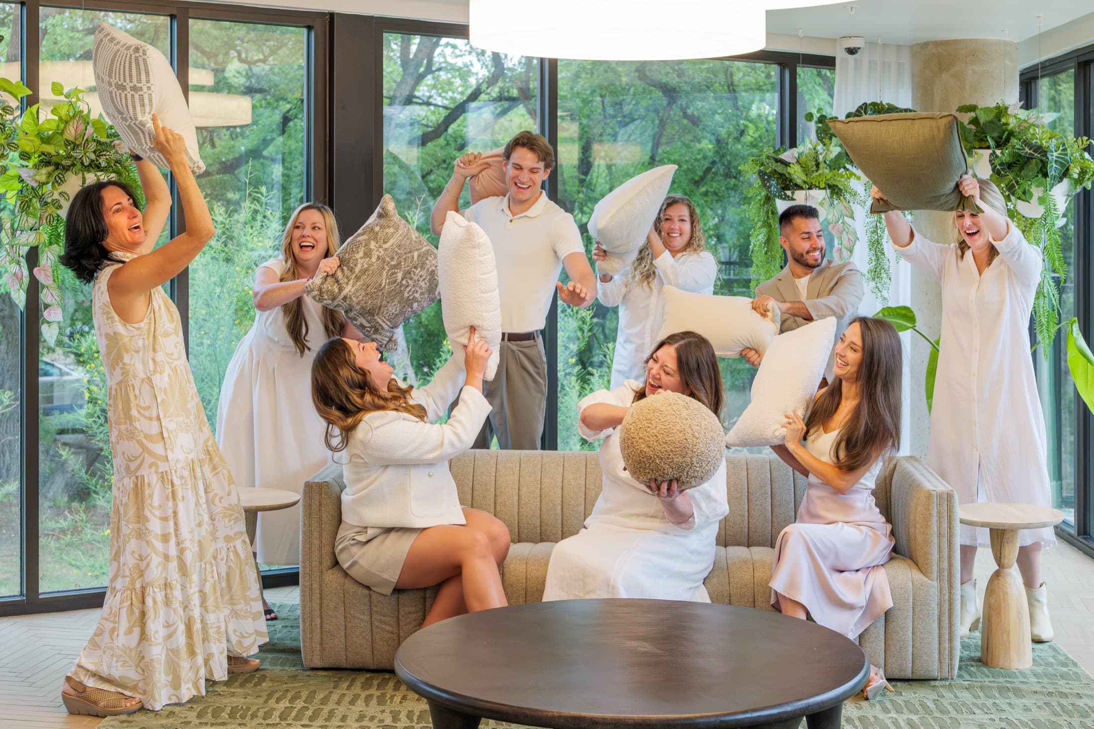 Sandi and the KREW team laughing during a playful photo shoot